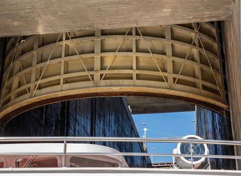 River cruise boat leaving the lock of the Carrapatelo dam on River Douro