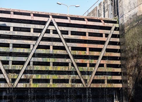 Water dripping from the lock gates of the Carrapatelo dam on River Douro as the level in the dock goes down