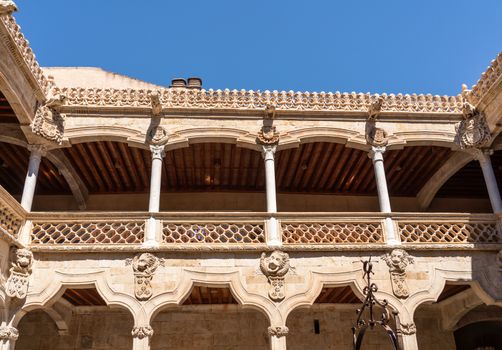 Ornate stone carvings on the Casa de la Conchas or shells around the central courtyard in Salamanca