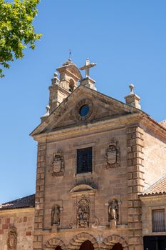 Detail of the bell tower and stork bird nest on the roof of San Pablo church in Salamanca Spain