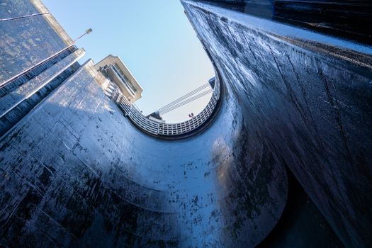View towards the sky inside the very deep lock of the Barragem do Carrapatelo on Douro River in Portugal