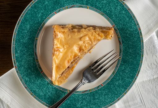 From above view of greek baklava honey dessert takeout food plated at home with napkin