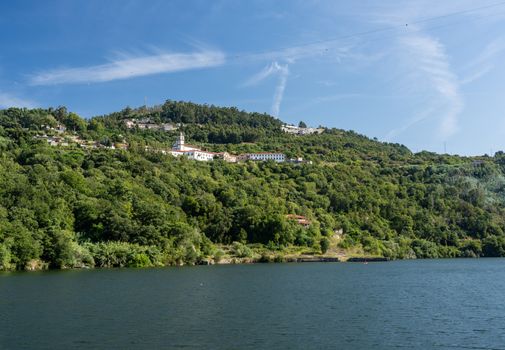 Whitewashed old Alpendurada convent on the banks of the River Douro in Portugal