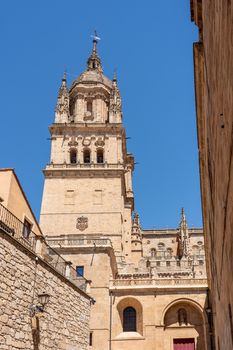 Exterior view of the bell tower and carvings on the roof of the old Cathedral in Salamanca