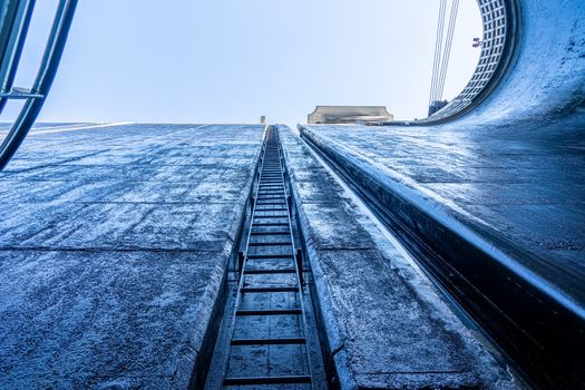 View towards the sky inside the very deep lock of the Barragem do Carrapatelo on Douro River in Portugal