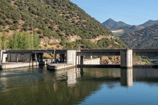Solid structure of the Valeira dam on River Dourowith lock and gates on the left