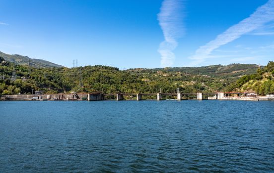 Solid structure of the Carrapatelo dam on River Douro in Portugal with the lock gates on the right