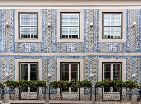 Decorative ceramic tiles on a large house with balconies in downtown Lisbon, Portugal