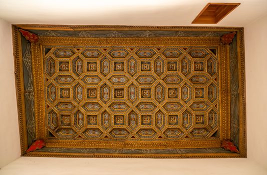 Ornate carved wooden ceiling inside the Casa de la Conchas or shells around the central courtyard in Salamanca