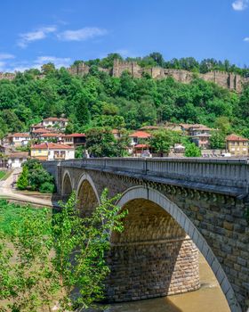 Bridge over the Yantra River near Veliko Tarnovo Fortress, Bulgaria. Hi res panoramic view on a sunny summer day.