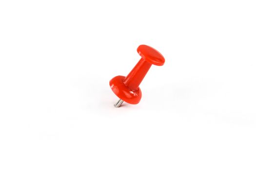 Red push pin isolated on white background