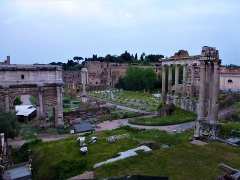 Ruins of the Roman Forum with archs and piles in Rome, Italy