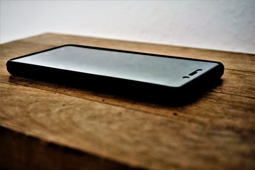 Close up of smartphone on wooden table
