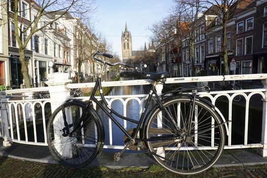 Vintage bike in front of city canal in Delft