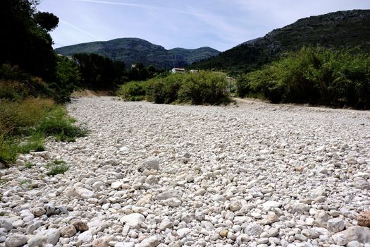 Dry bed of the river Gorgos in the town Benigembla, Spain