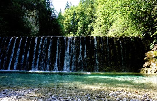 Sava waterfall in Kranjska Gora, Slovenia cascading down a wall