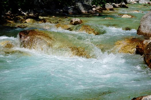 Close up of turquois Isonzo river near Trenta, Slovenia