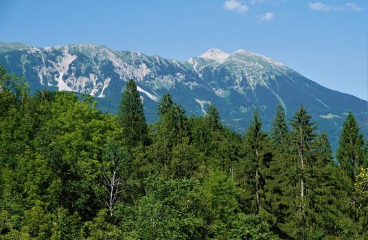 View from Vintgar Gorge, Slovenia over forest to Mezakla peaks