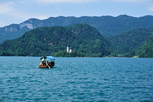 Traditional Pletna boat on it's way to Bled Island, Slovenia