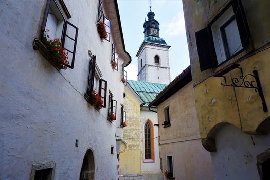 Old houses and church in Slovenian city Skofja Loka