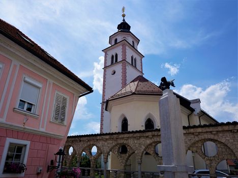 Pink house and Saint Roch's Church in Kranj, Slovenia