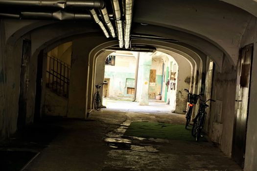 Dark passage with bicycles in Ljubljana, Slovenia