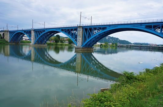 A blue bridge over the Drava river in Maribor, Slovenia