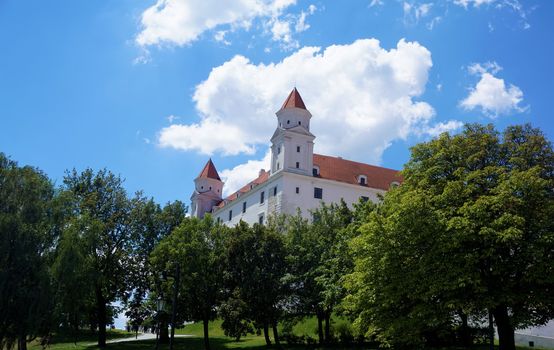 The castle of Bratislava, Slovakia behind trees