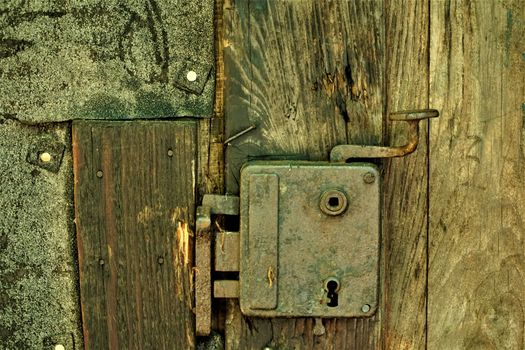 Rusty lock of one Baza 20 house Kocevski rog, Slovenia