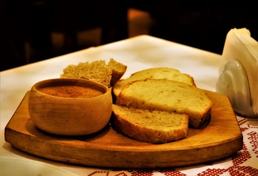 Delicious Bulgarian white bread and paprika powder in Sofia Restaurant