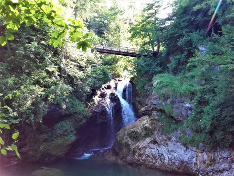 Bridge over Sum waterfall at the end of Vintgar Gorge near Bled, Slovenia