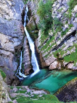 Turquoise Savica fall streaming down the rocks