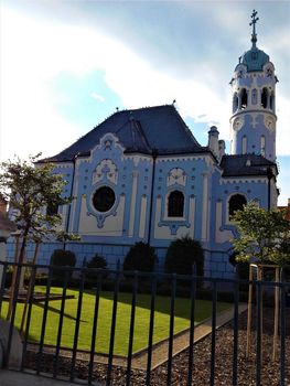 Blue church of Bratislava, Slovakia behind fence