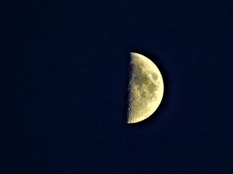 Close up of half moon shimmering kind of yellow