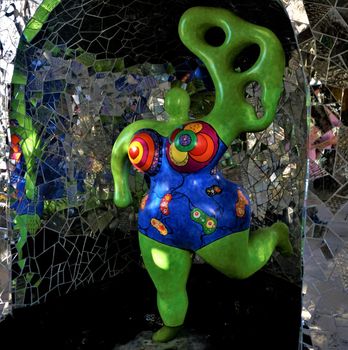 Green Nana with blue dress - pop art in the Niki de Saint Phalle grotto Hanover, Germany