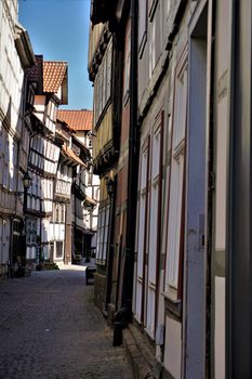 Narrow street with crooked houses in the old town of Hann. Munden, Germany