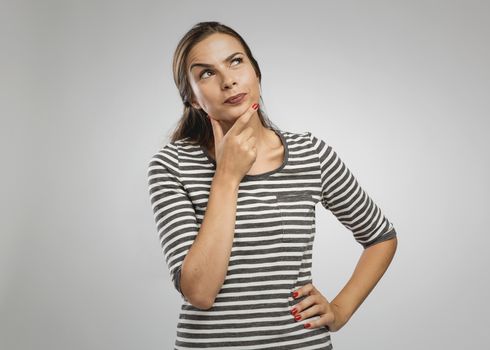 Portrait of a beautiful woman with a thinking expression