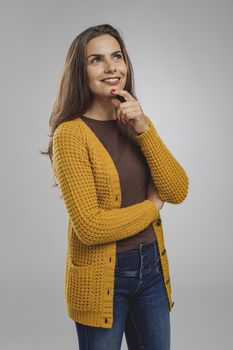 Shot of a beautiful young woman havong a happy thoughts