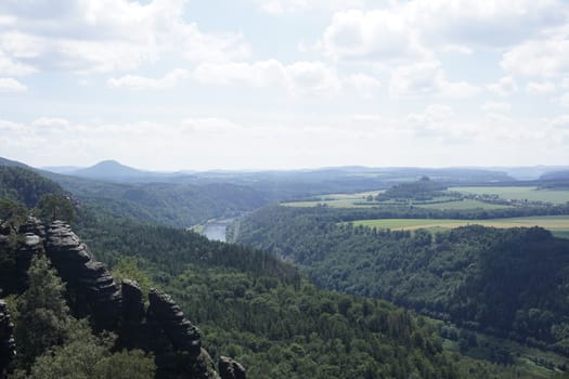 View from the Schrammsteine rocks to the Elbe river and Zirkelstein mountain in Saxon Switzerland