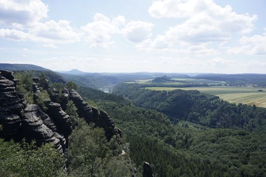 View from Schrammstein mountains over impressive landscape of Saxon Switzerland and Bohemian Switzerland