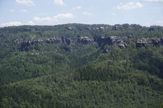 Impressive sandstone rocks peeling out of the forest in the Schrammsteine region of Saxon Switzerland