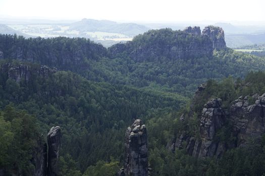 Panoramic view from Carolafelsen over lots of famous sandstone rocks of Saxon Switzerland