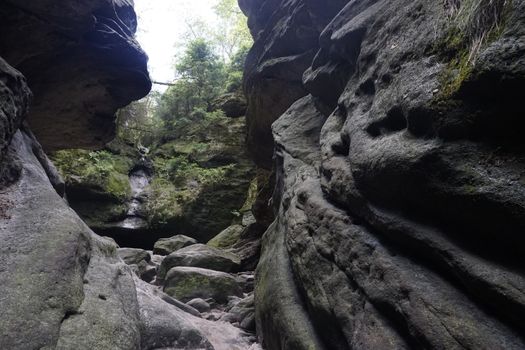 Surrounded by grey sandstone rocks in Saxon Switzerland, Germany