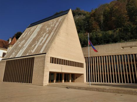 The parliament and flag of Liechtenstein in the city of Vaduz