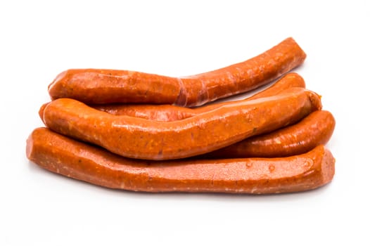 Raw Merguez on a white background. Butcher, meat.