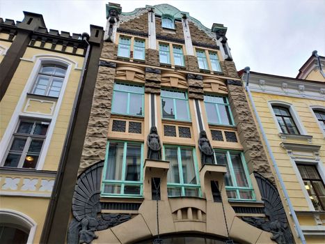 House decorated with dragons and egyptian looking ladies in Tallinn, Estonia