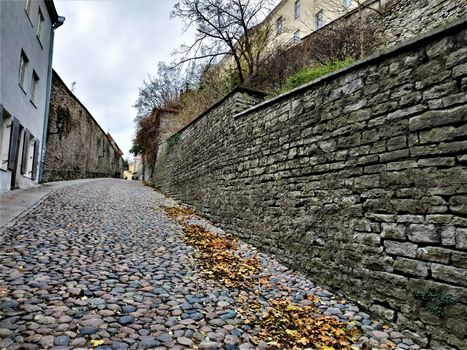 Beautiful Pikk jalg cobblestone road in Tallinn, Estonia