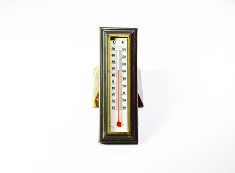 Alcohol thermometer in the frame. Red scale thermometer.
