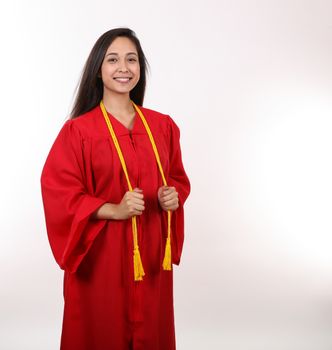 A young latina is ready to graduate.
