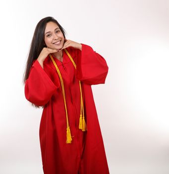 A pretty graduating student poses for the camera.